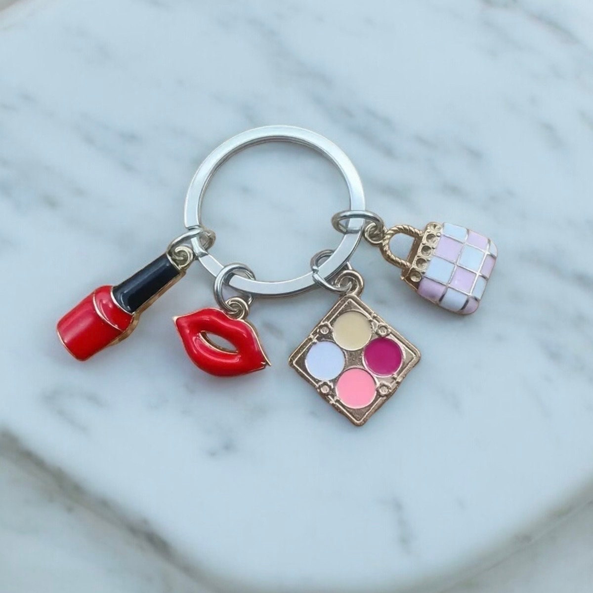 Nail Polish, Red Lips, Eye Shadow, Purse, Pendant Keychain is a stylish and practical accessory for anyone who loves to accessorize.