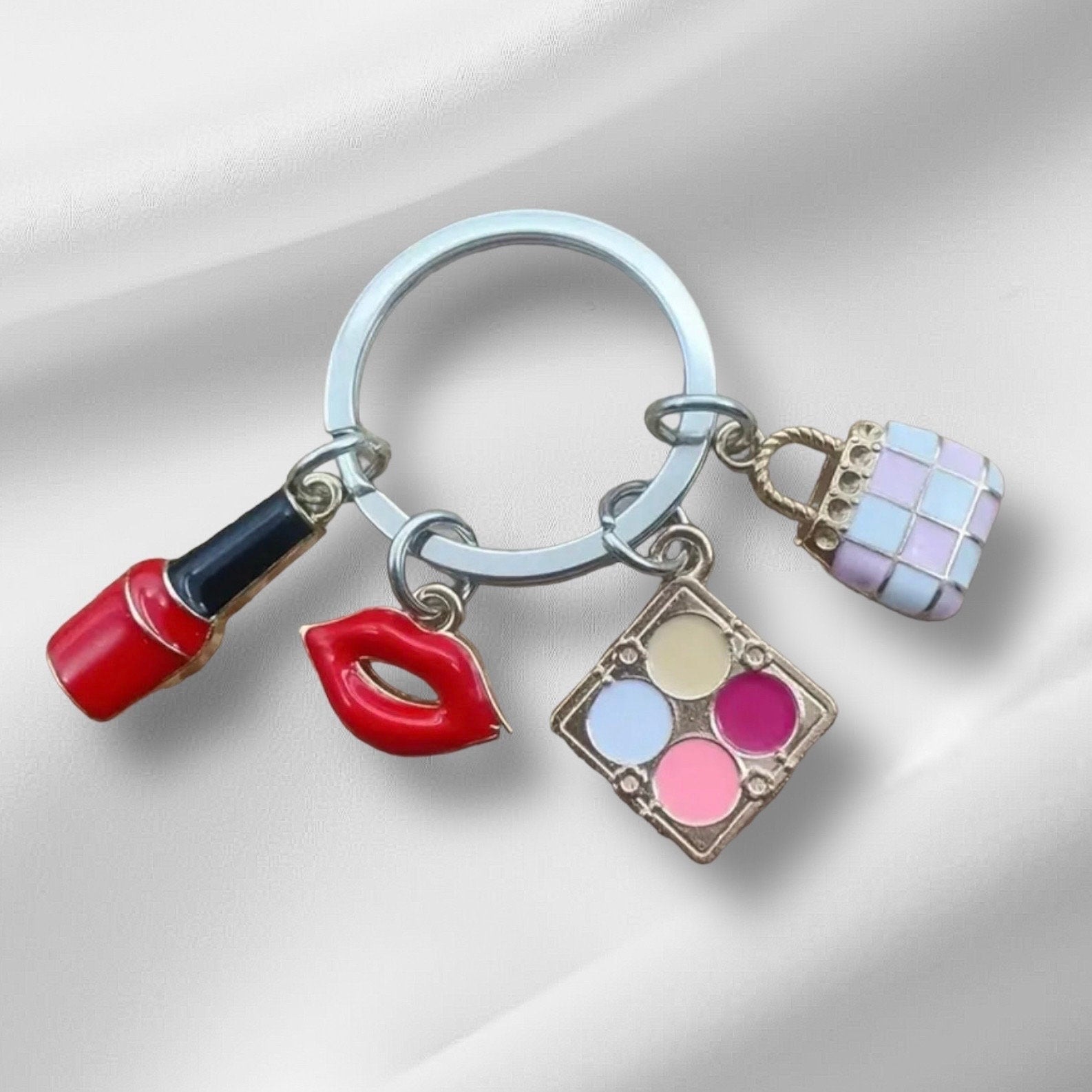 Nail Polish, Red Lips, Eye Shadow, Purse, Pendant Keychain is a stylish and practical accessory for anyone who loves to accessorize.