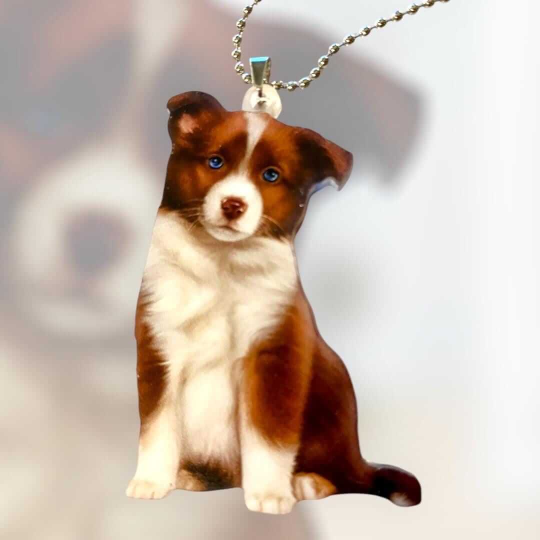 Cute brown Border Collie acrylic keychain ornament featuring a detailed dog design, perfect for bags or car mirrors.