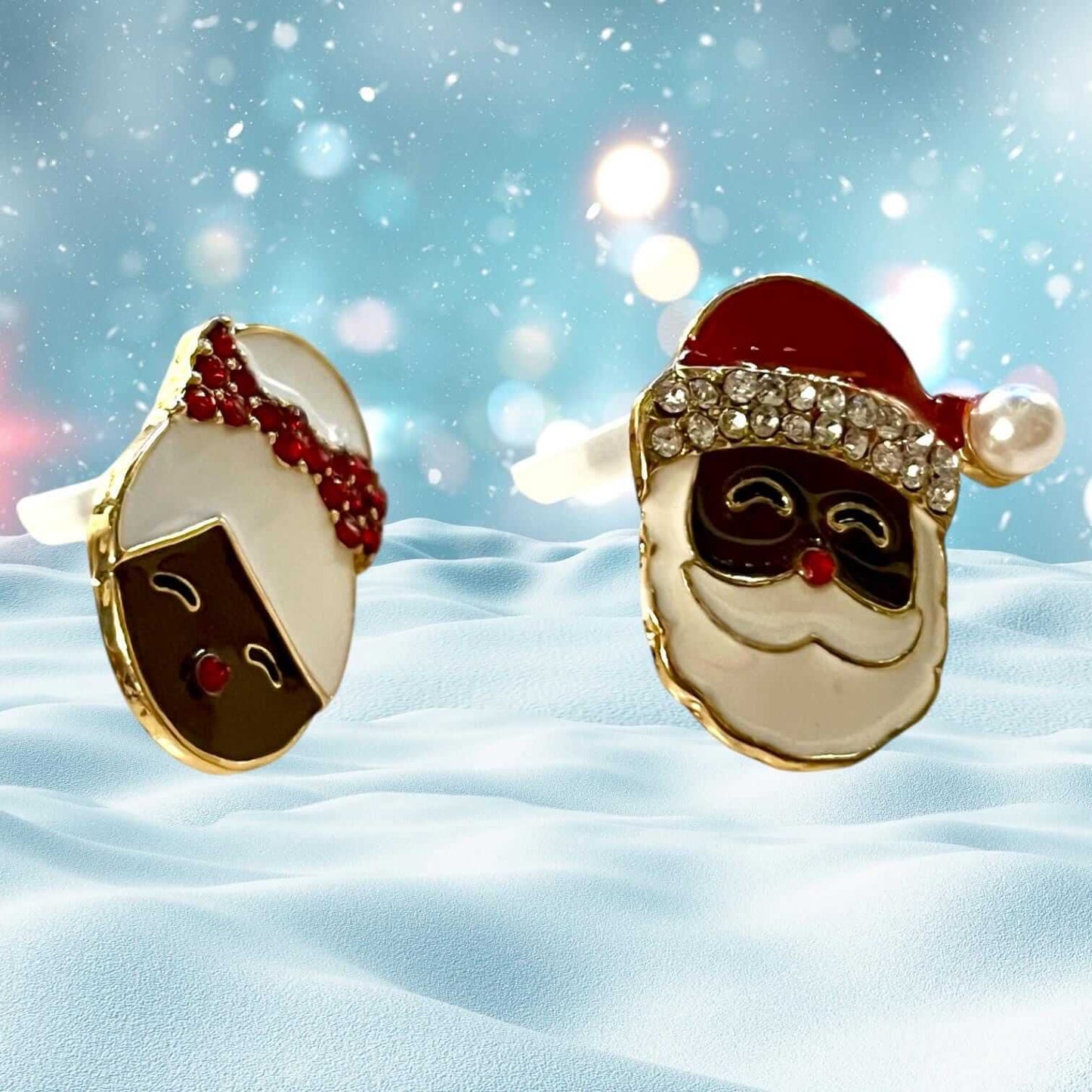 Sparkly Santa and Mrs. Claus Christmas enamel stud earrings with faux diamonds and pearls against a festive holiday background